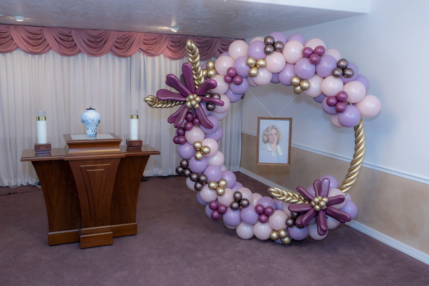 Lavender and gold halo memorial balloon presentation with portrait display.